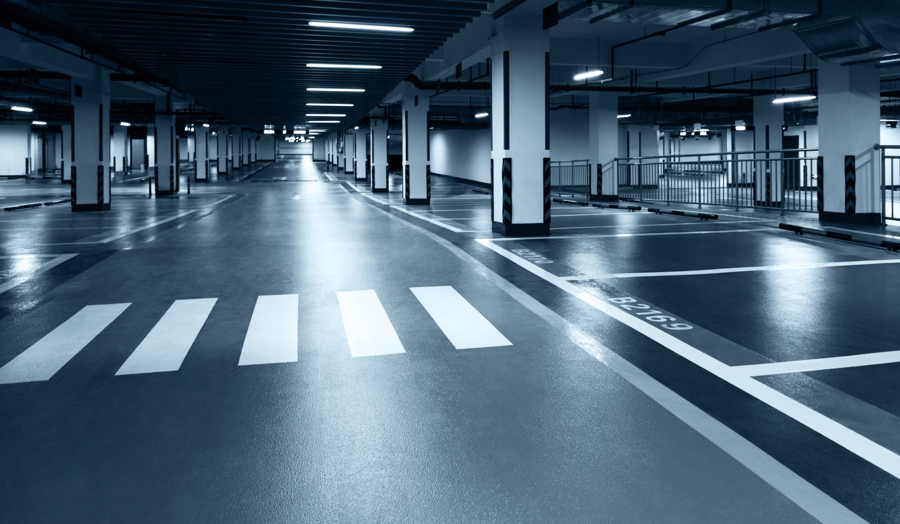 Empty underground parking lot in modern building.